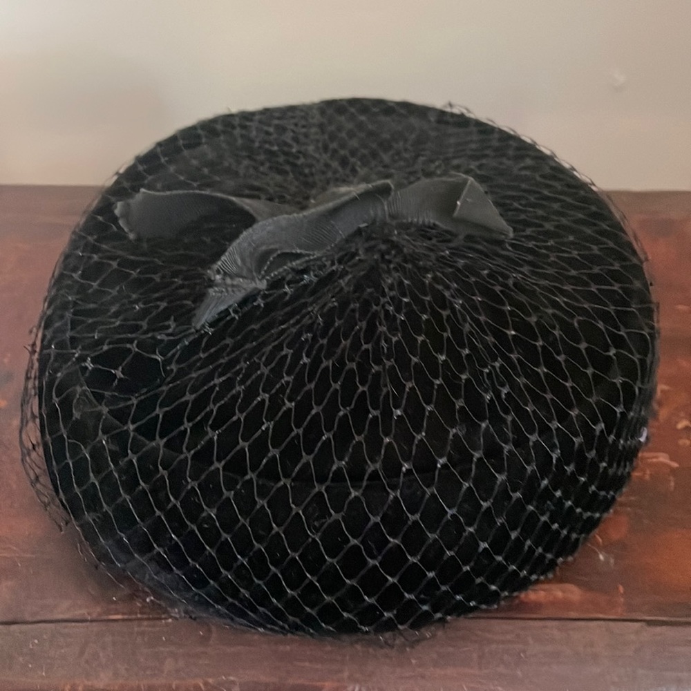 Black hat with black netting and bow
